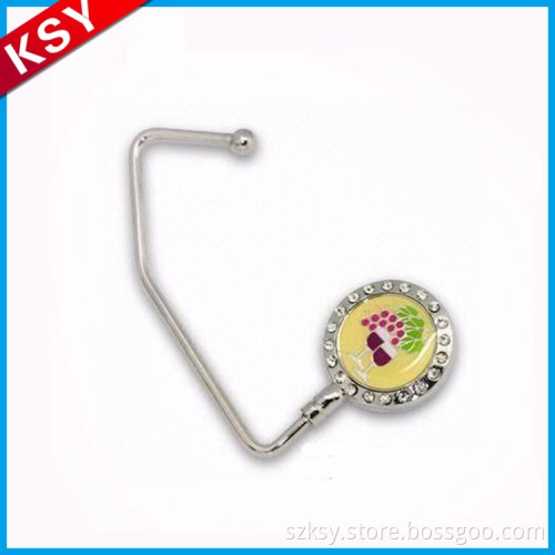 Hot Sale Good Quality Engraved Logo Carved Hand Bag Hanger custom logo purse hanger Hook For Table